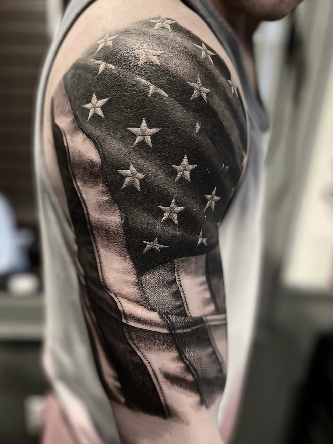 American flag stars shoulder tattoo by Steve Young