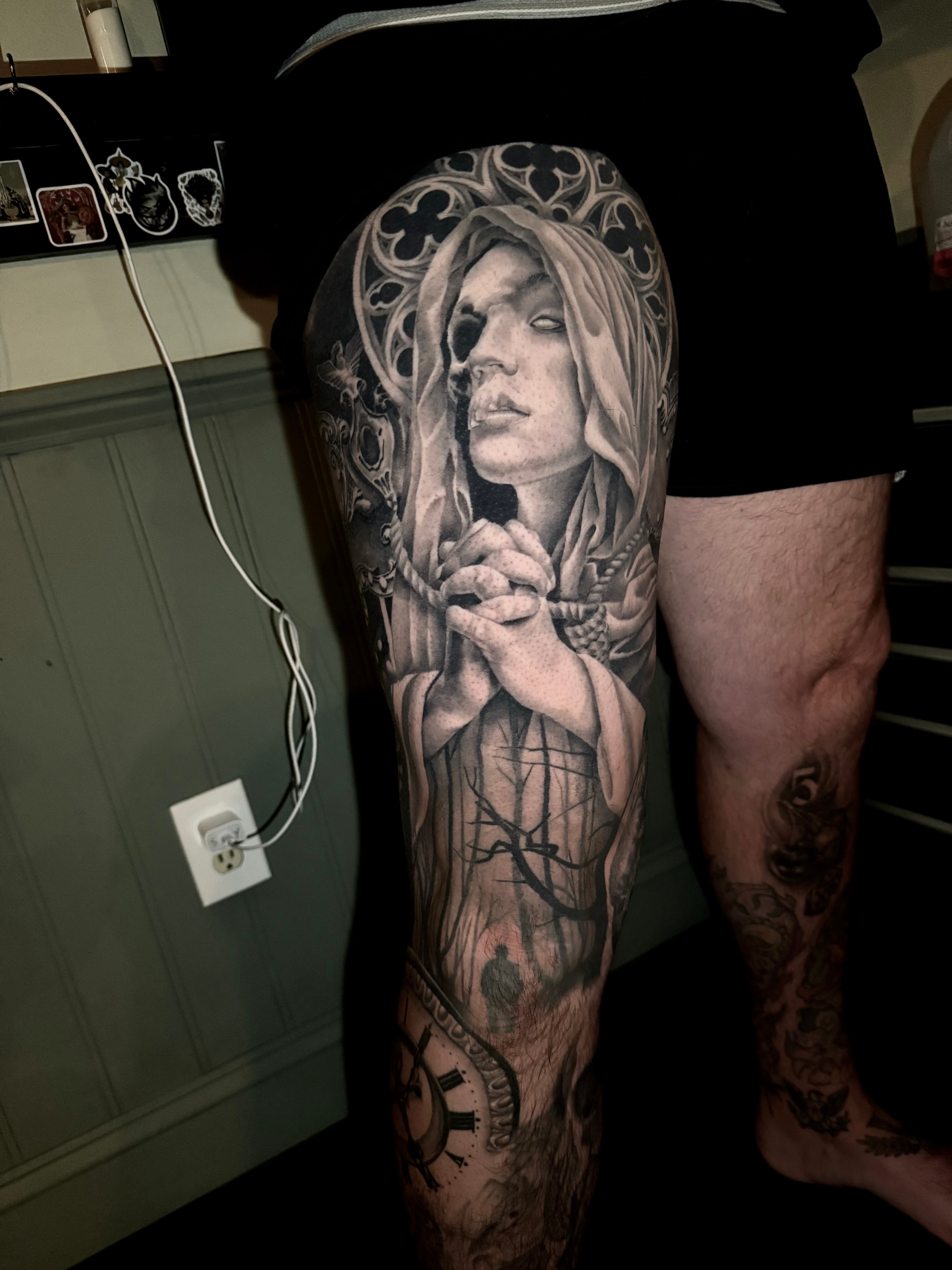 Detailed portrait tattoo on leg sleeve by Steve Young
