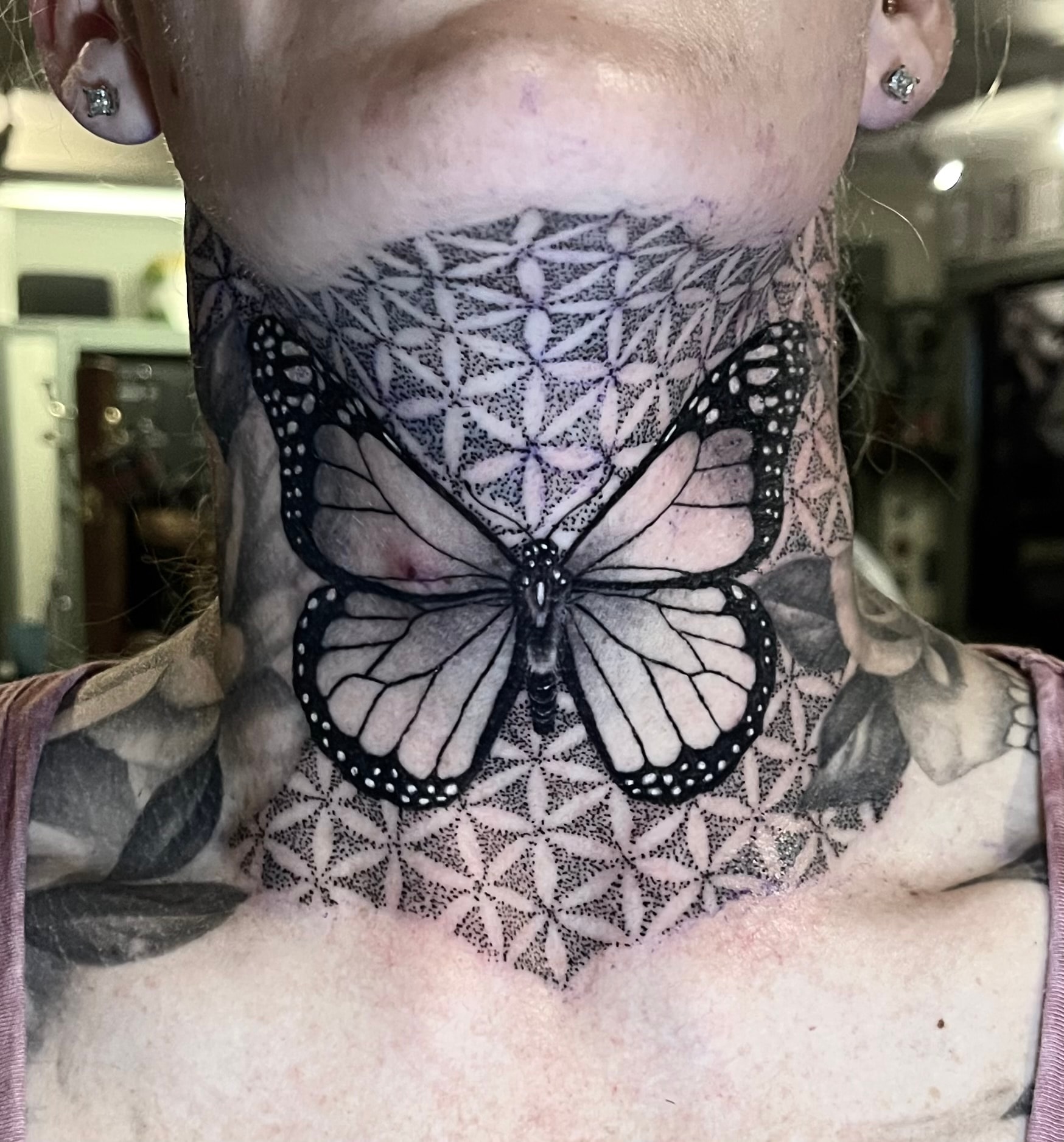Butterfly neck tattoo by Steve Young