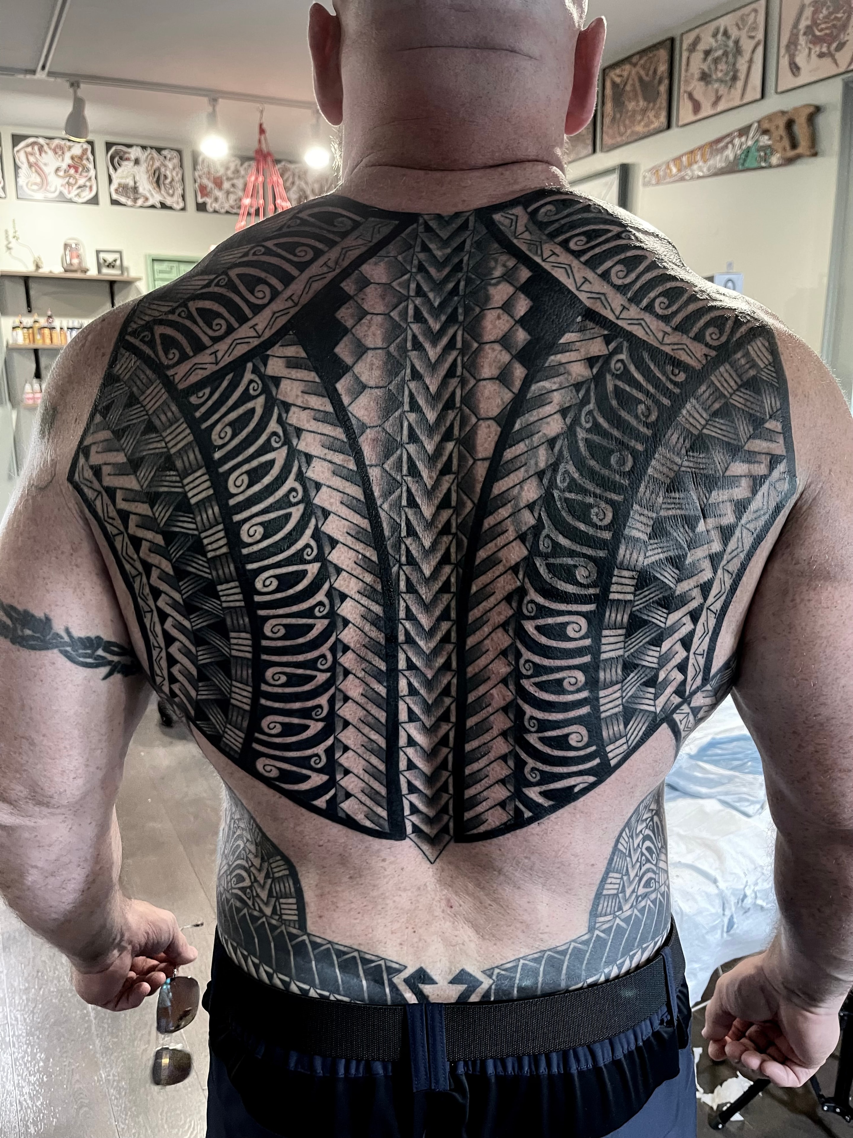 Large geometric back tattoo by Steve Young