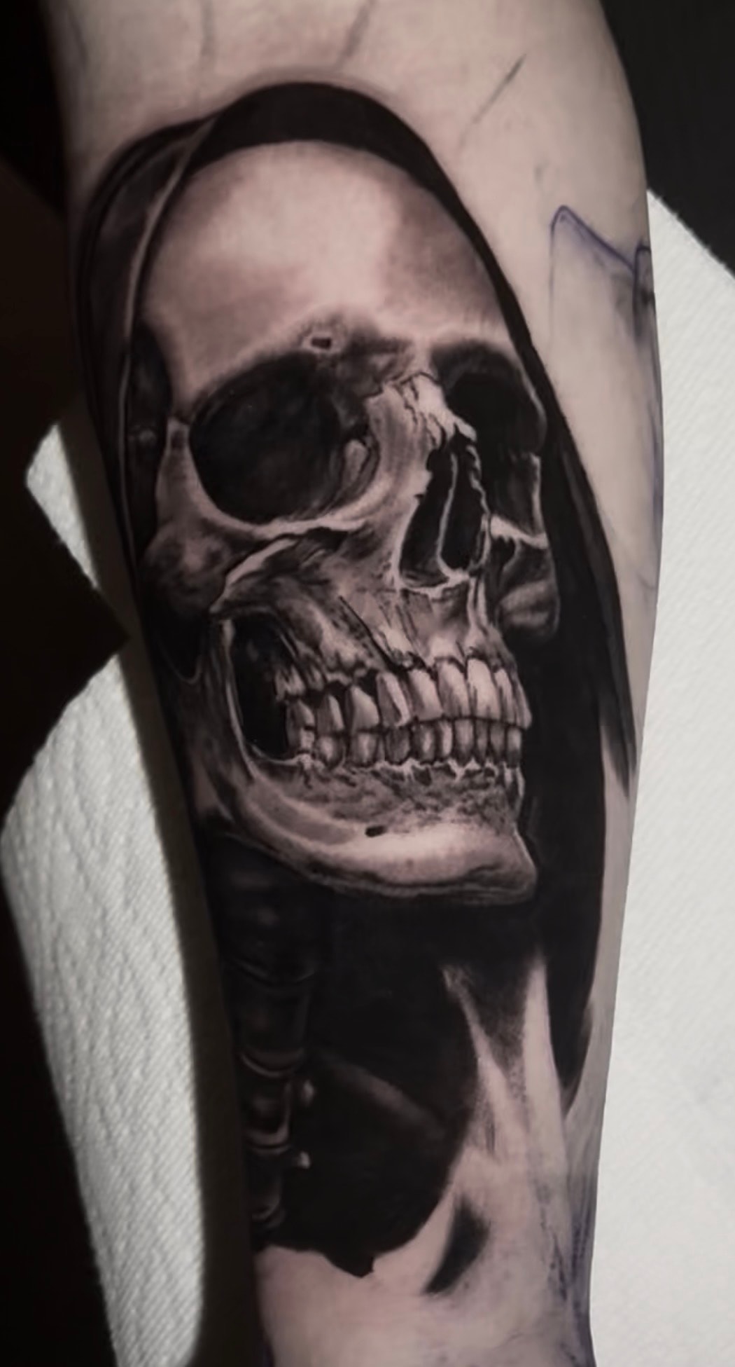 Grim reaper skull forearm tattoo by Steve Young